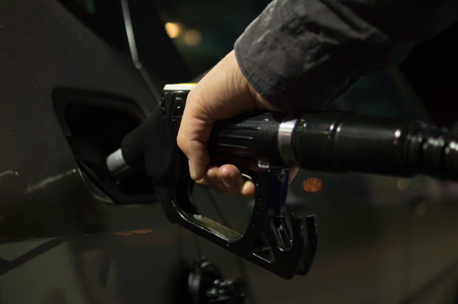 man partially pumping diesel in to his car