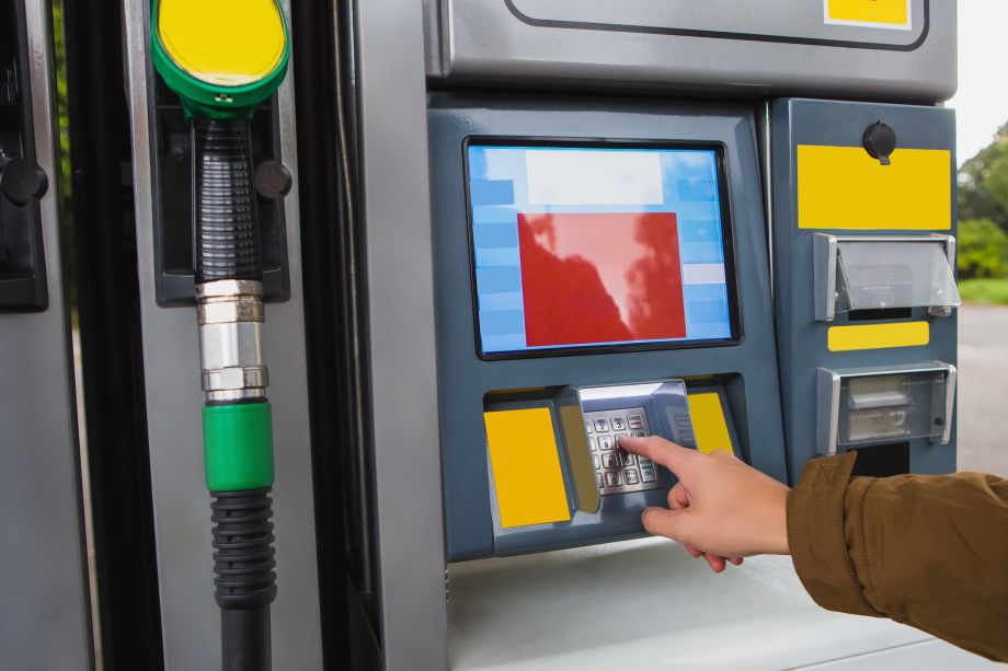 Paying for fuel at the pump station using a fuel card and entering a PIN code