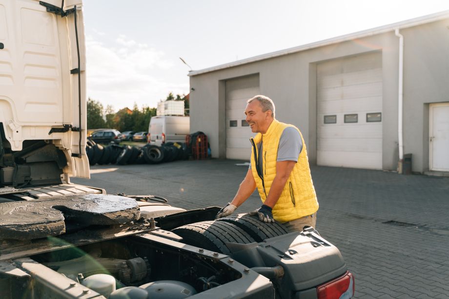 Fleet maintenance worker replacing tyres on a fleet vehicle on a work site