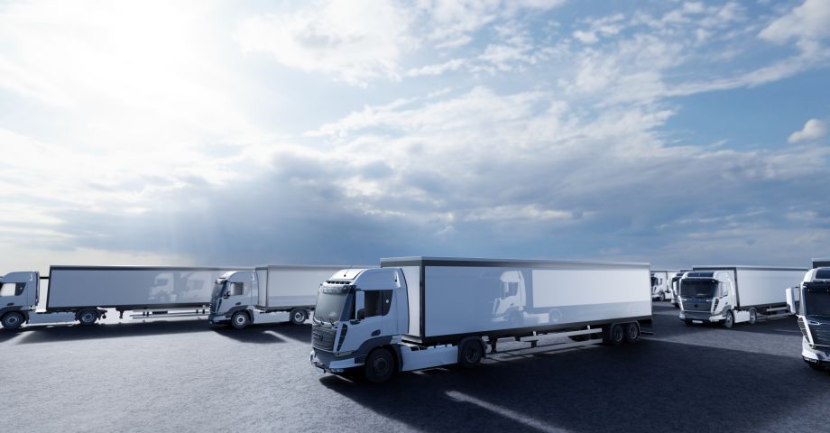 Heavy truck fleet vehicles parked in a truck stop transporting goods