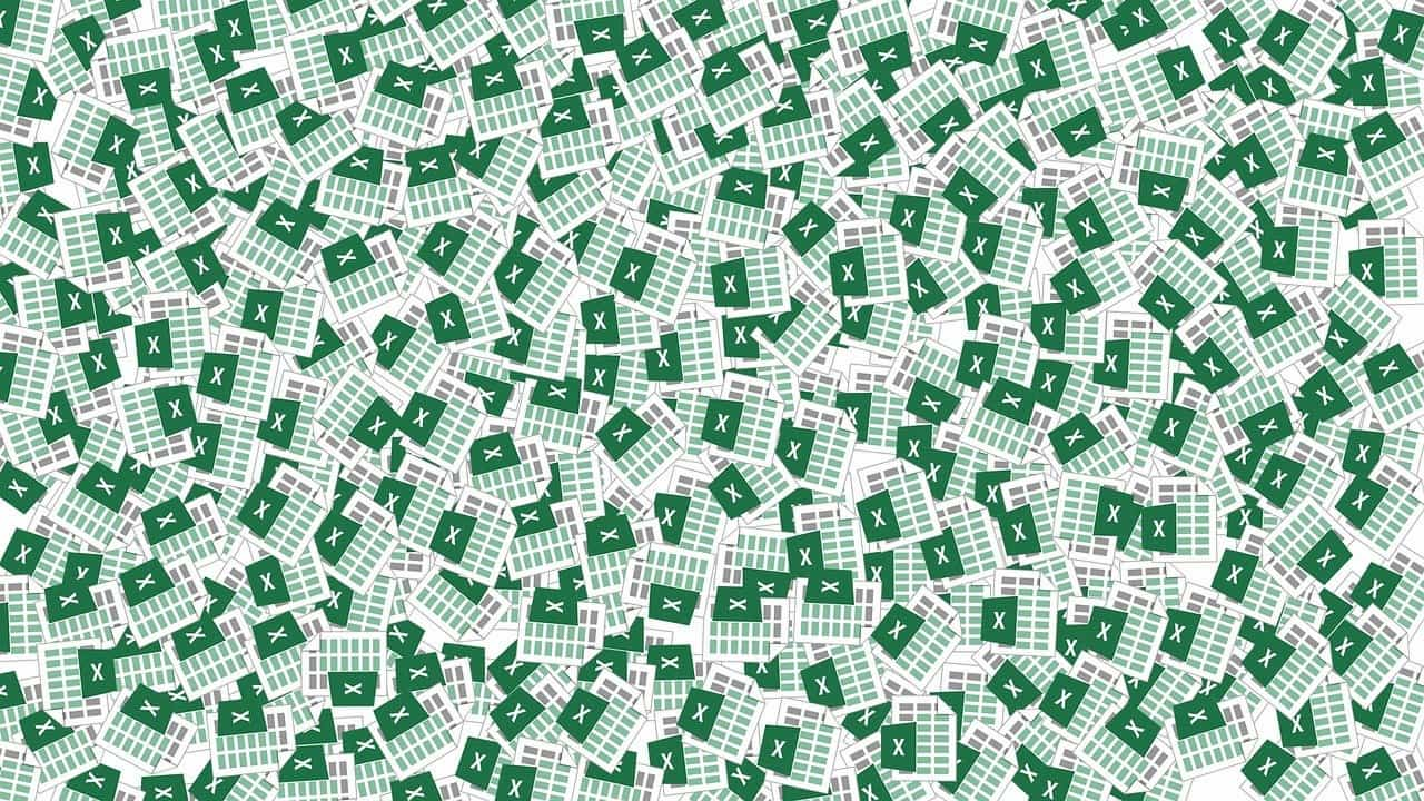 A pile of excel spreadsheet logos demonstrates the mess of cash flow issues you get if you don’t use accounting software