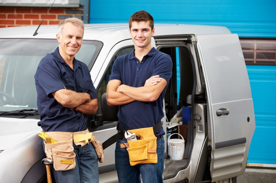 Men stood outside van