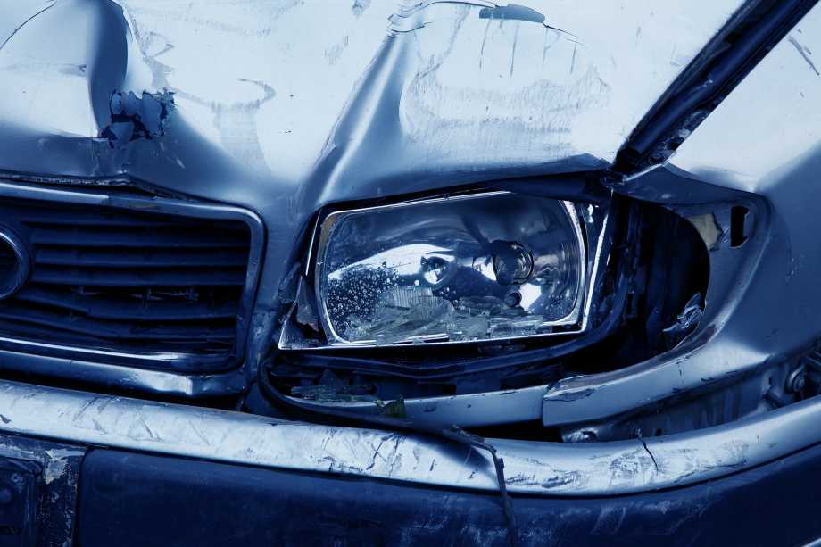 A damaged car after an accident, indicating the need for vehicle insurance