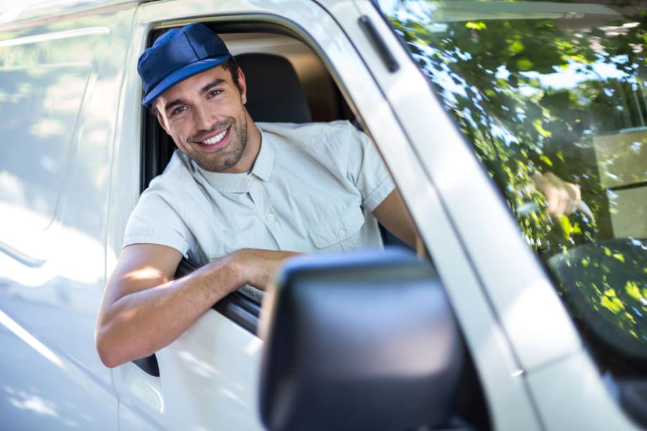 Man leaning out van window