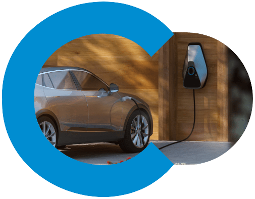 Company car EV business vehicle plugged into a charge point at home