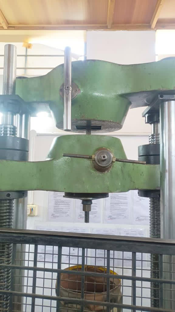Hydraulic load test press with bolt assembly