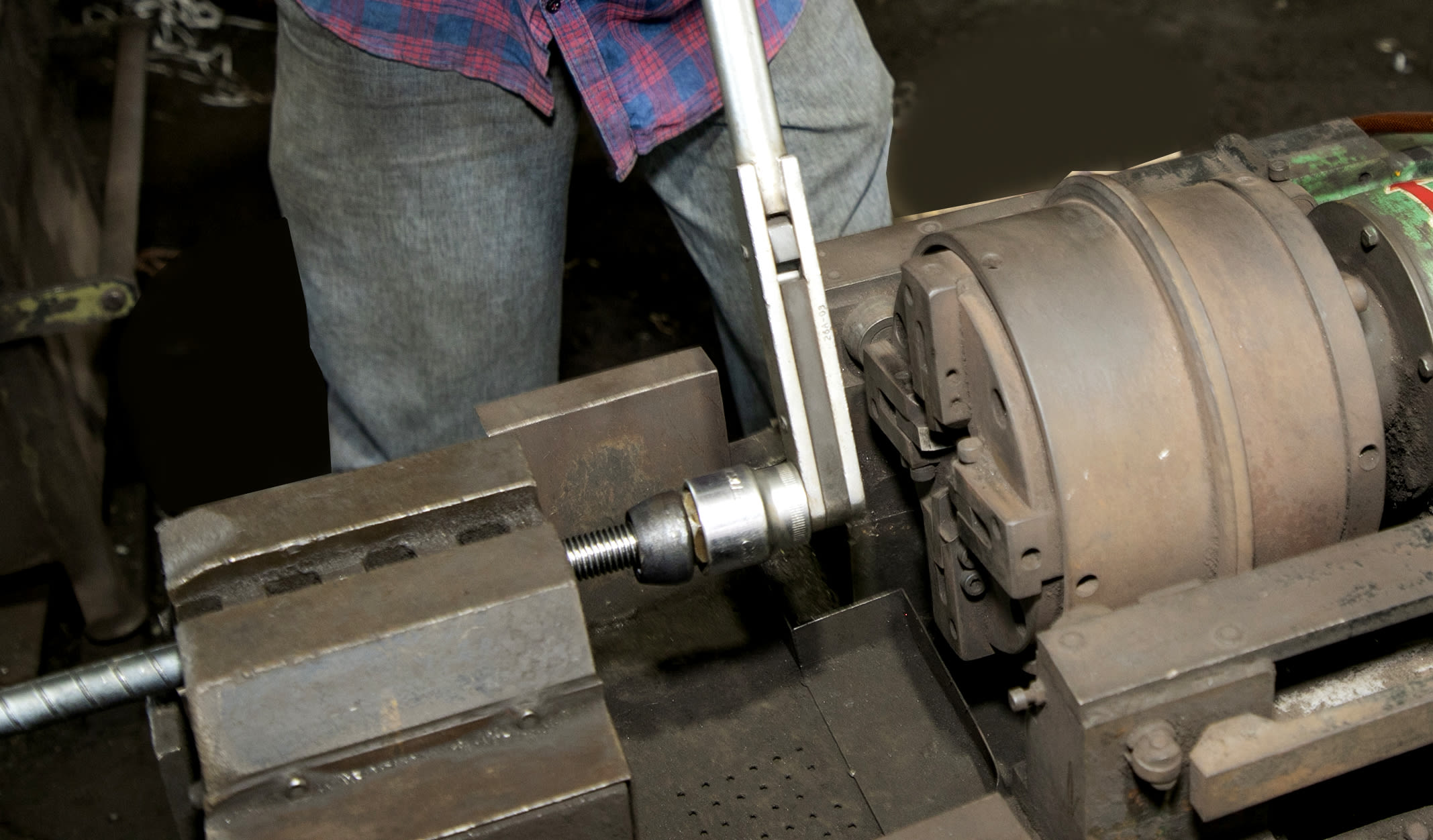 Worker performing shear pin torque test