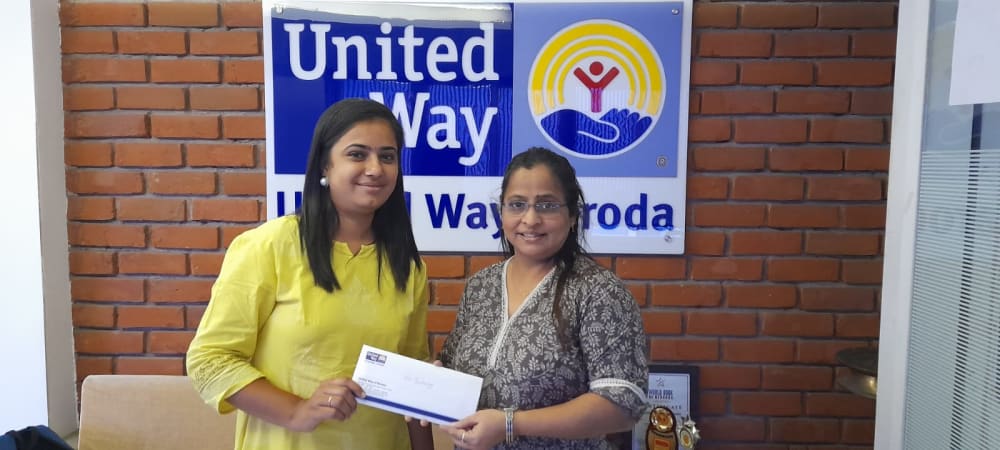 Cheque Presentation — Donation Handover at United Way Baroda