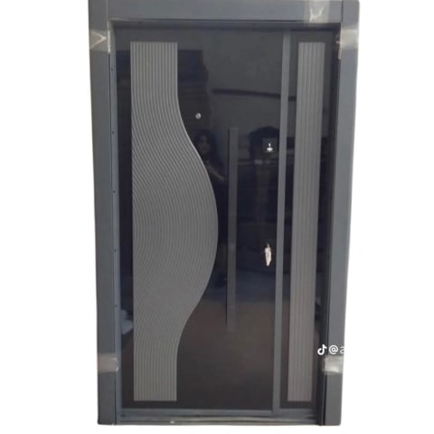 Modern Grey Security Door with Sculpted Wave Panel Make a statement at your entrance with this contemporary security door.