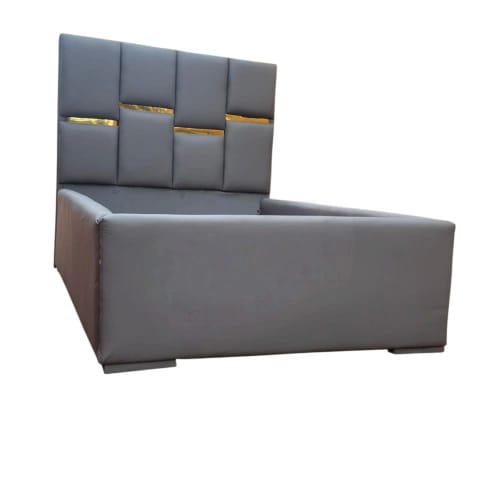 Grey Upholstered Bed with Tall Panelled Headboard and Gold Accents