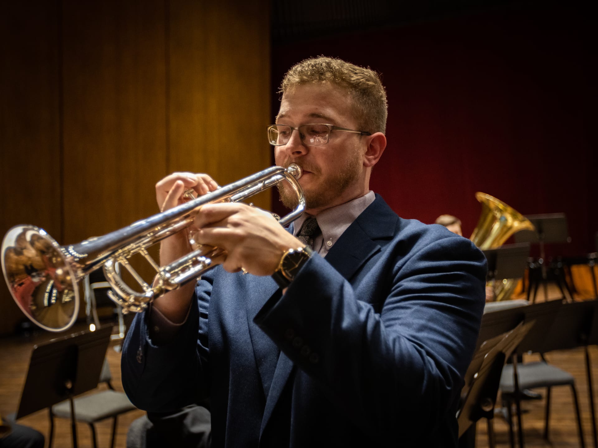 Robert Collins, close up, holding a trumpet