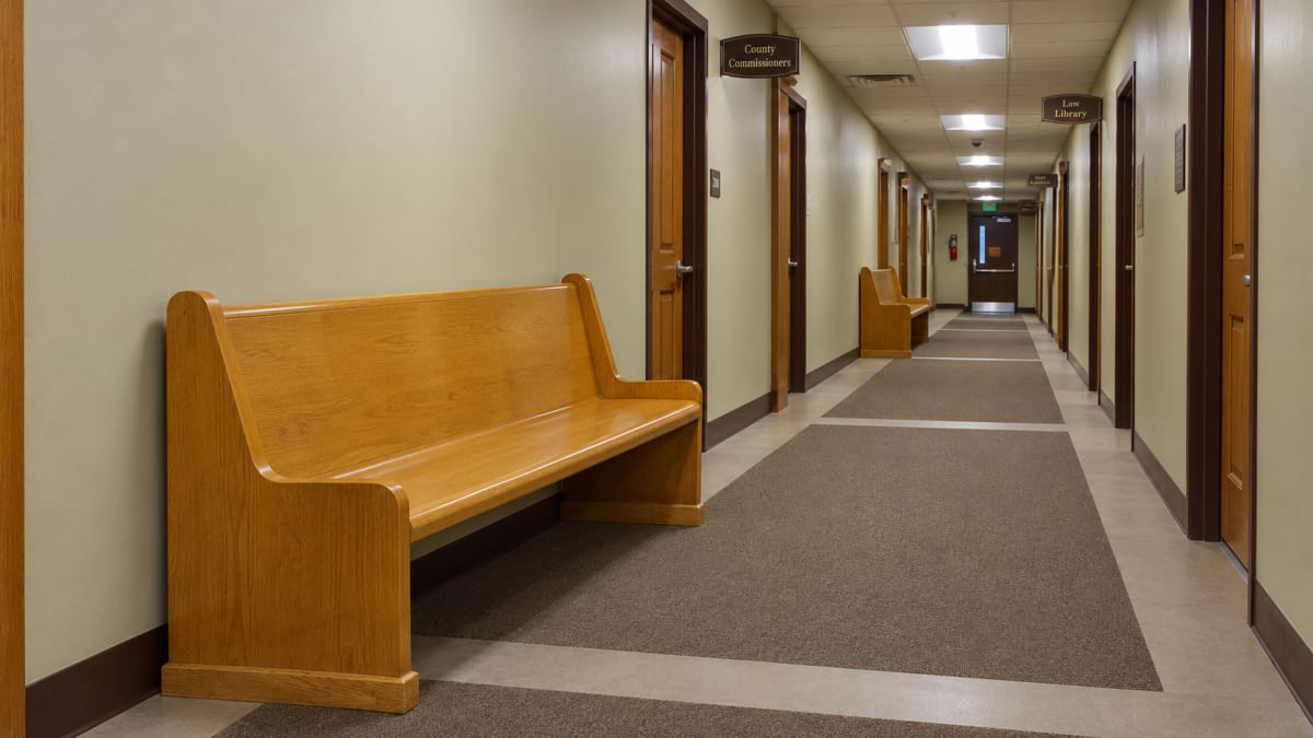 Empty witness waiting bench at the courthouse