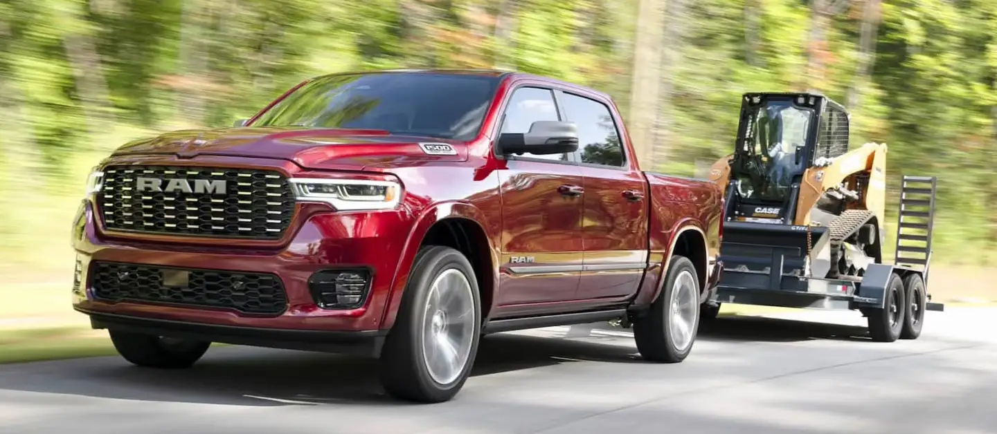 Ram truck towing a tractor