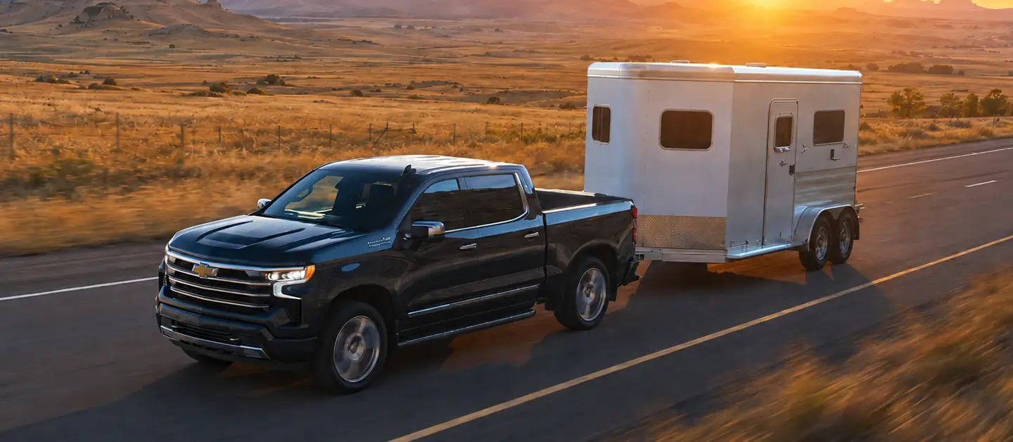 Used Chevrolet Silverado towing a horse trailer