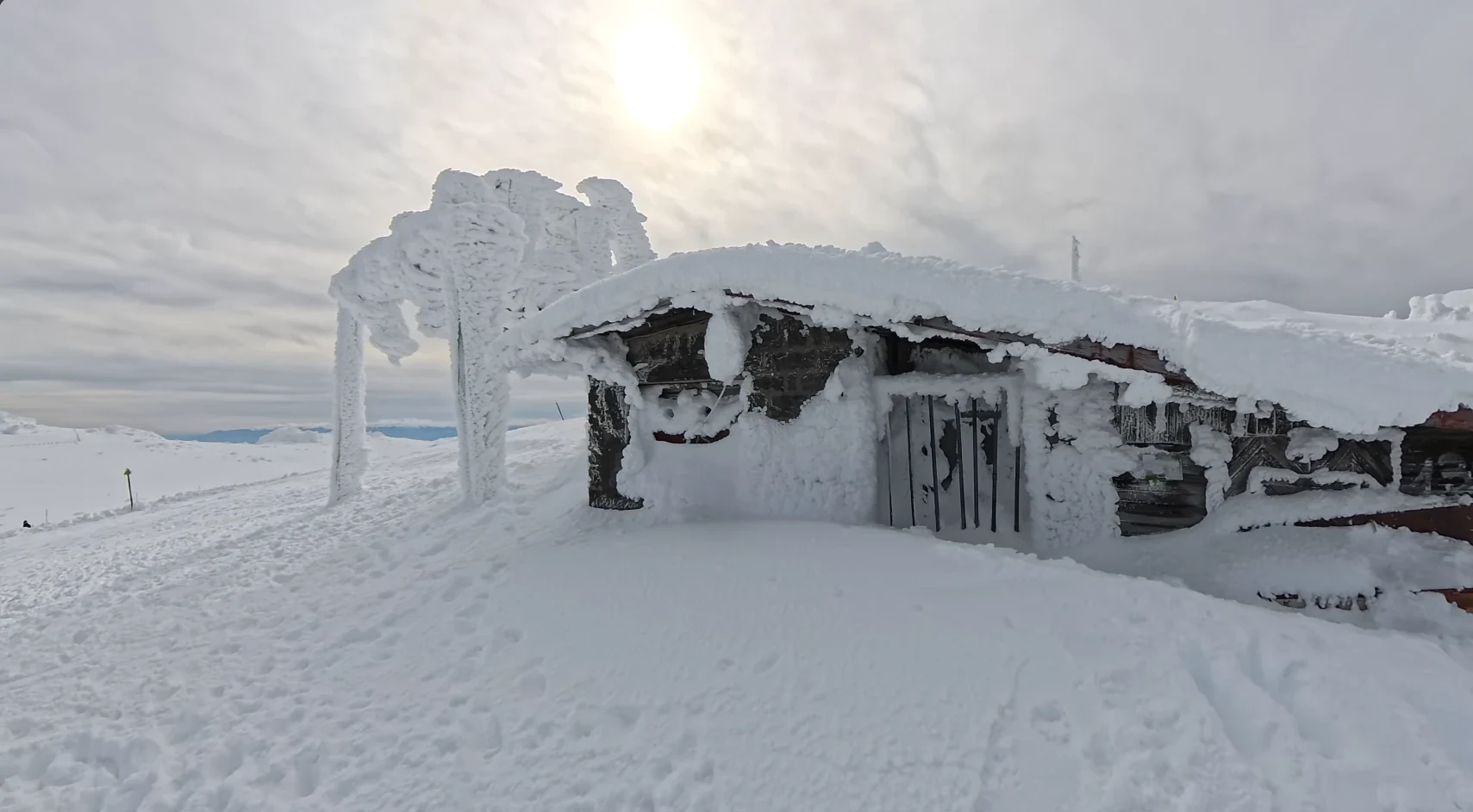 The cluttered buildings before the black peak, a PSS warehouse?