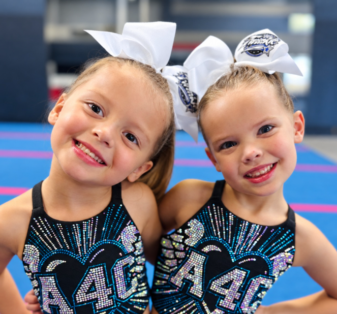 Two All 4 athletes in team uniforms