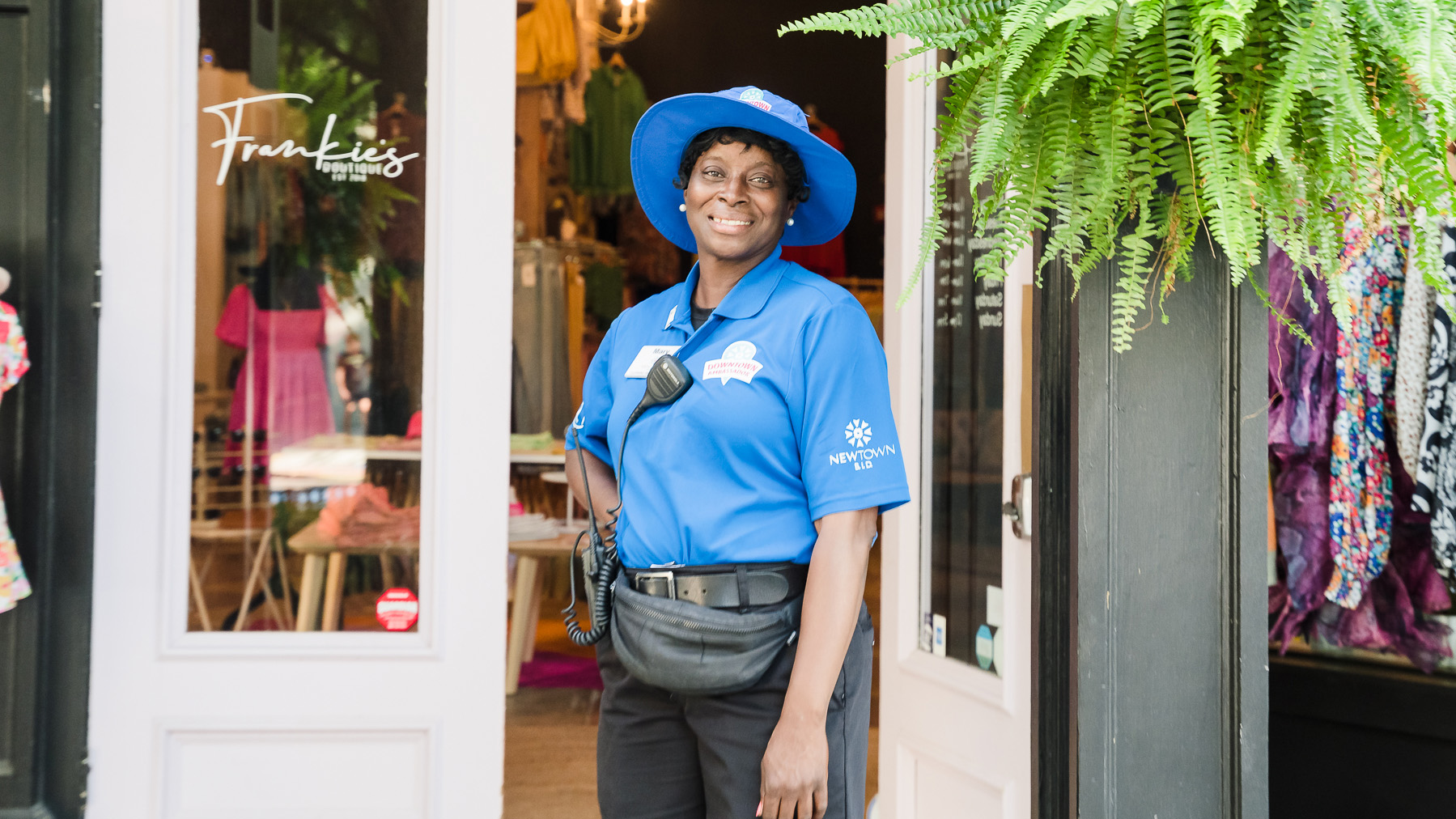 A BID Ambassador stands in front of Frankie’s in downtown Macon.