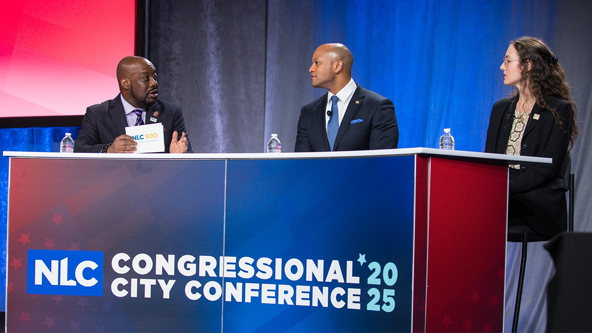 Savannah Mayor and NLC Second Vice President Van Johnson, left, moderated a fireside chat on disaster response and resilience with Maryland Governor Wes Moore and West Hollywood Mayor Chelsea Byers du