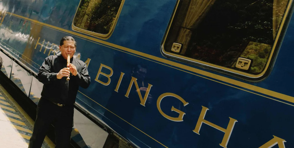Belmond Hiram Bingham luxury train to Machu Picchu with a Peruvian musician