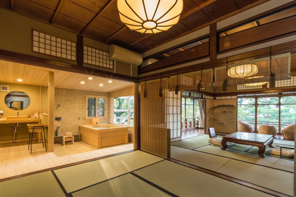 Japanese tatami room with wooden soaking tub and shoji screens at Capella Kyoto Gion