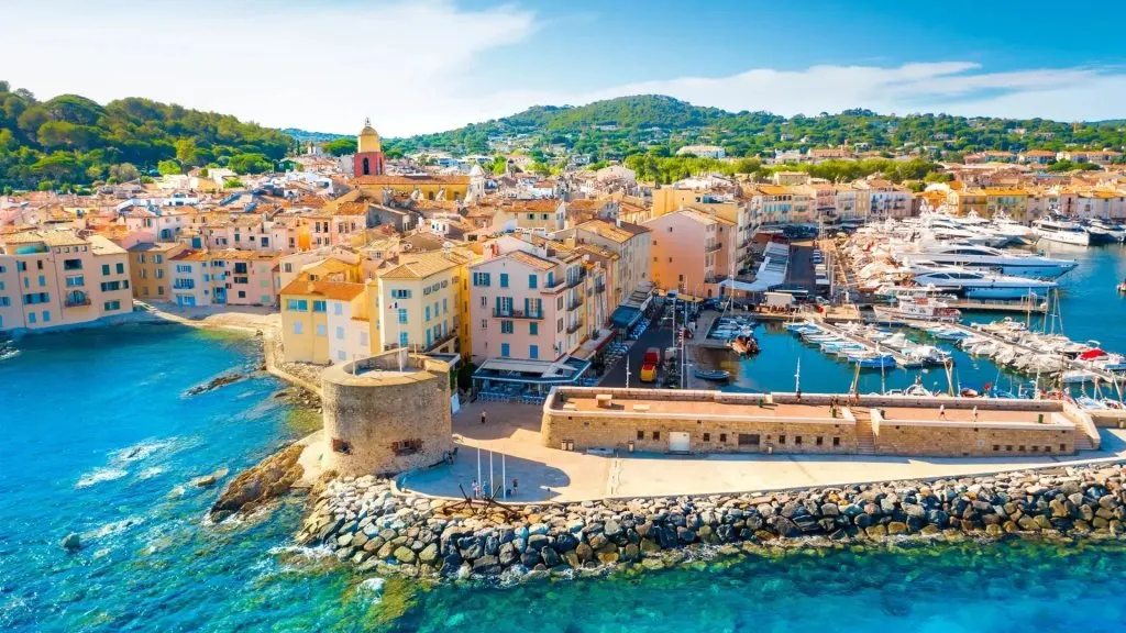 aerial view of Saint-Tropez old port with superyachts and colourful buildings Gulf of Saint-Tropez