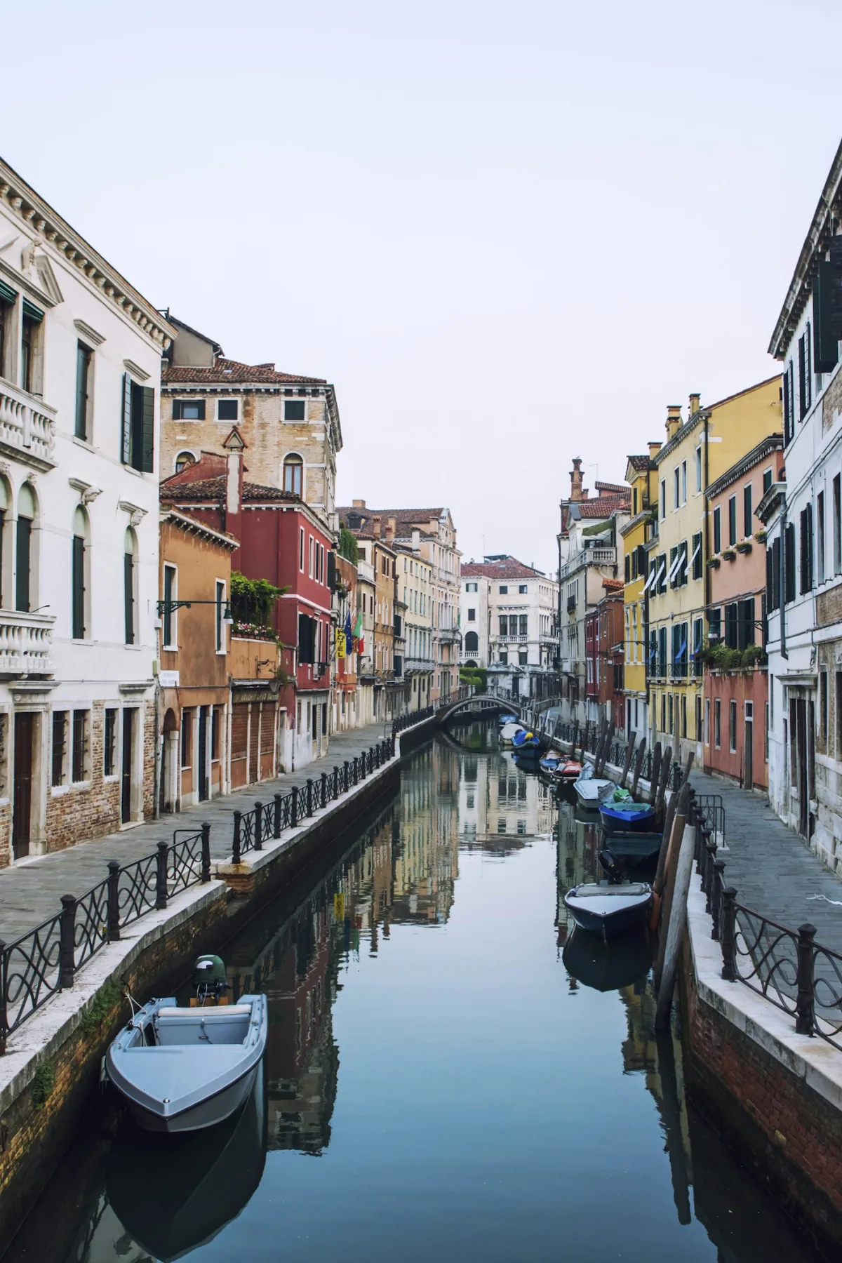 quiet Venice canal lined with colourful buildings in the Cannaregio district