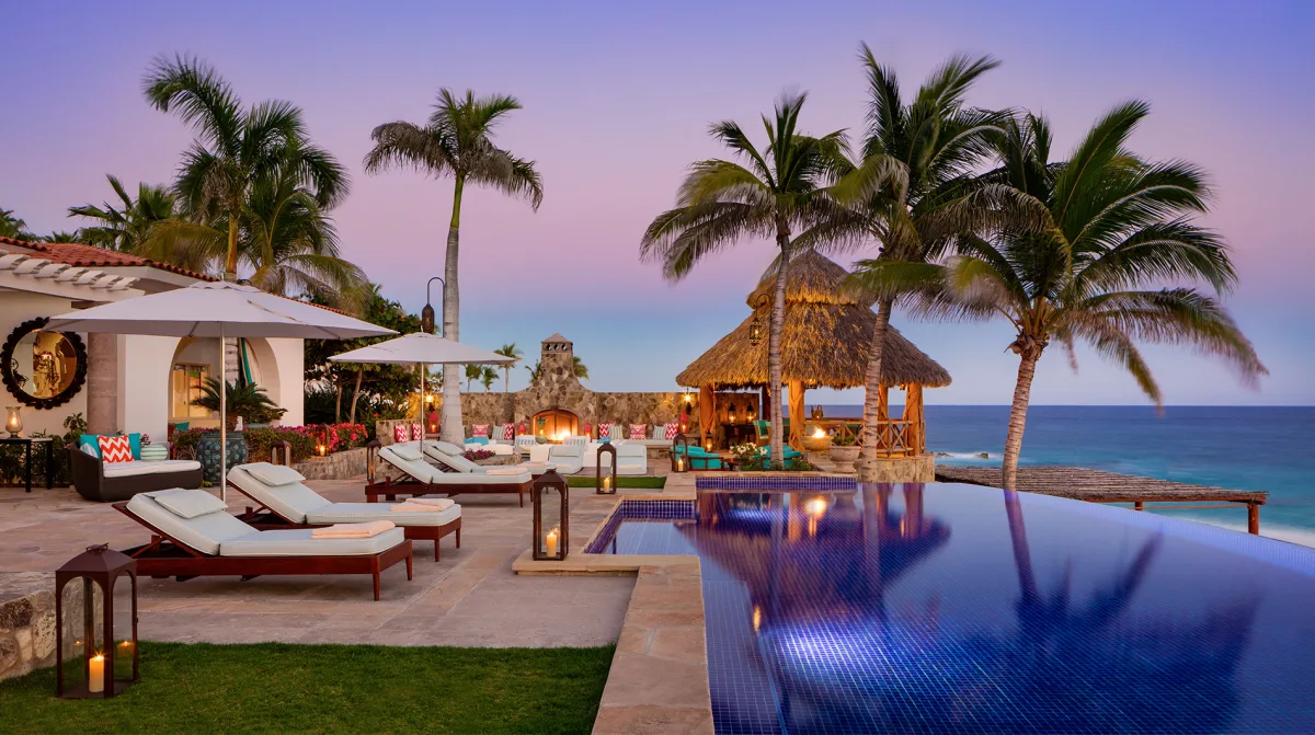 One and Only Palmilla Villa Cortez dusk infinity pool palapa palms Sea of Cortez Los Cabos