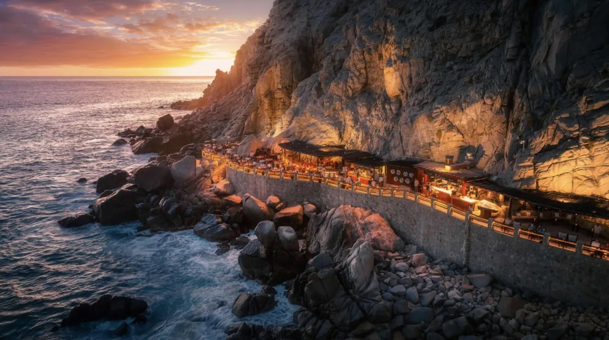 El Farallón restaurant at Waldorf Astoria Los Cabos Pedregal cliffside cantilevered over Pacific Ocean at sunset