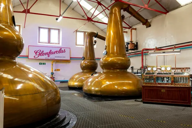 Copper stills in a Scottish distillery still house