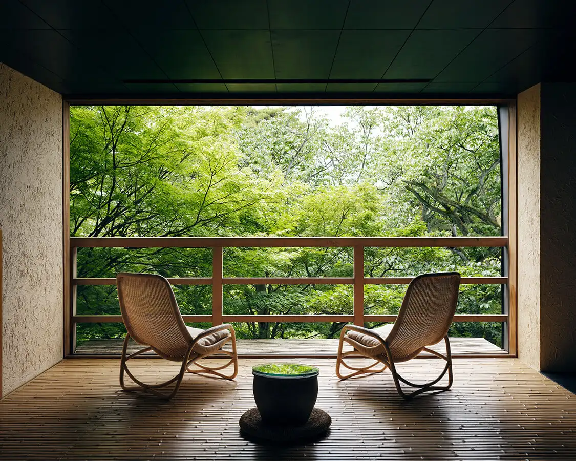 Beniya Mukayu Yamashiro Onsen private room deck overlooking forest garden — luxury ryokan Ishikawa