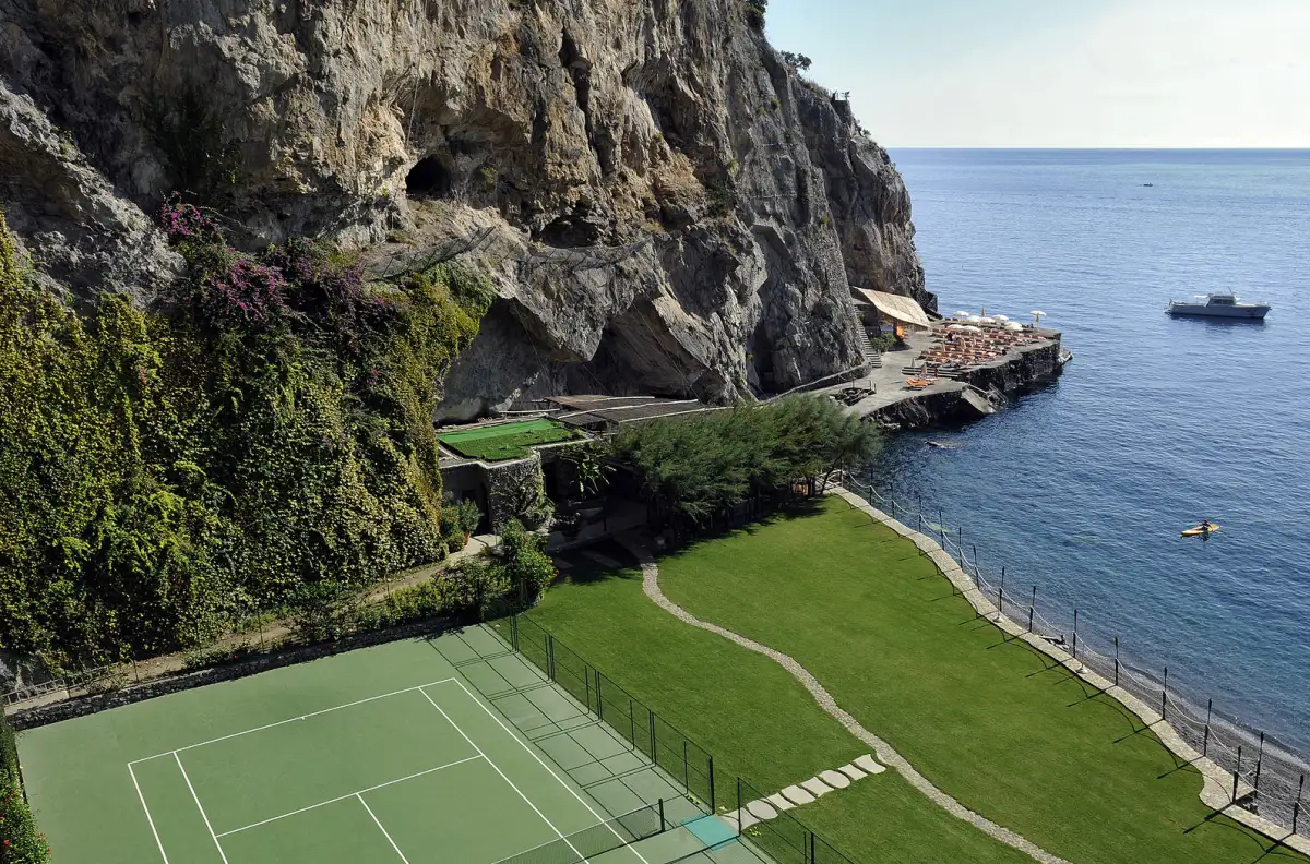 The seaside tennis court at Il San Pietro di Positano on the Amalfi Coast