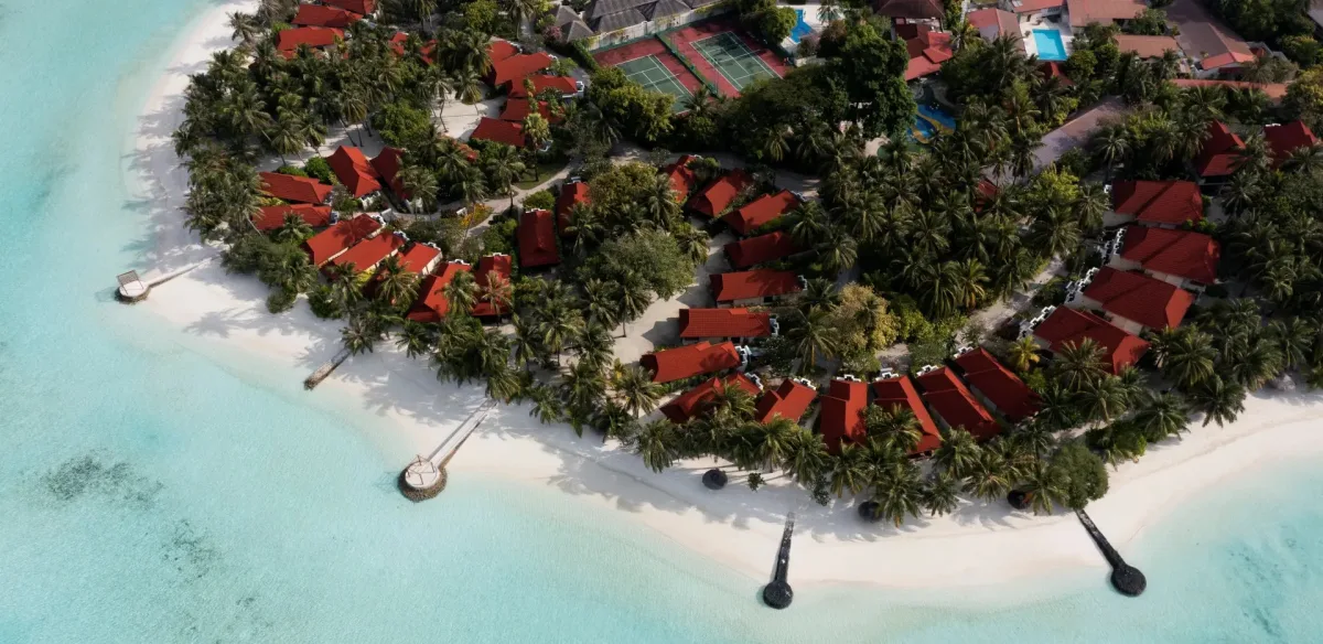 Aerial view of the island resort Kurumba Maldives ringed by turquoise water