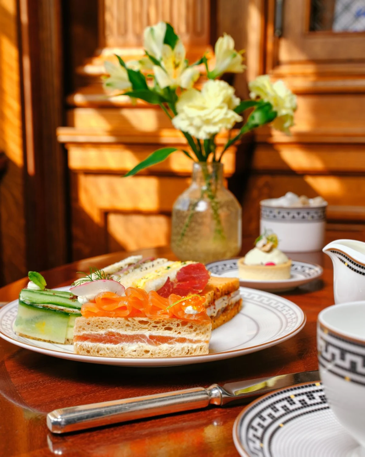 The Secrets and Spies afternoon tea at Raffles London at The OWO, served on Greek-key china