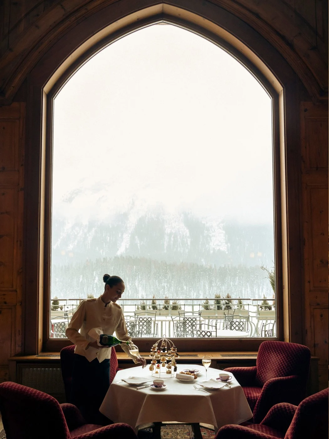 Badrutt's Palace Hotel St. Moritz dining room with lake and mountain views in winter