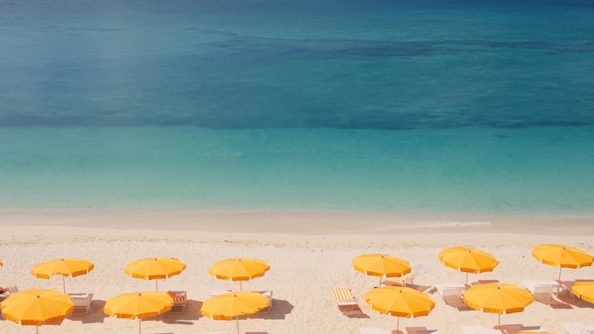 Palm Heights Grand Cayman yellow umbrellas on Seven Mile Beach