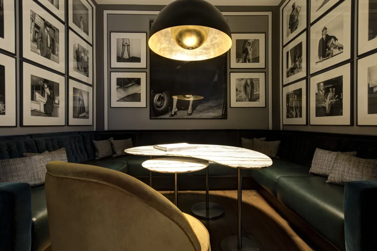 The dark, intimate Donovan Bar at Brown's Hotel in Mayfair, its walls lined with black-and-white photographs