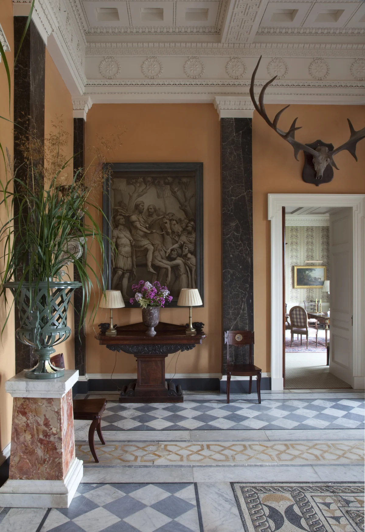 The Roman-inspired entrance hall at Ballyfin Demesne with mosaic marble floor and antique paintings