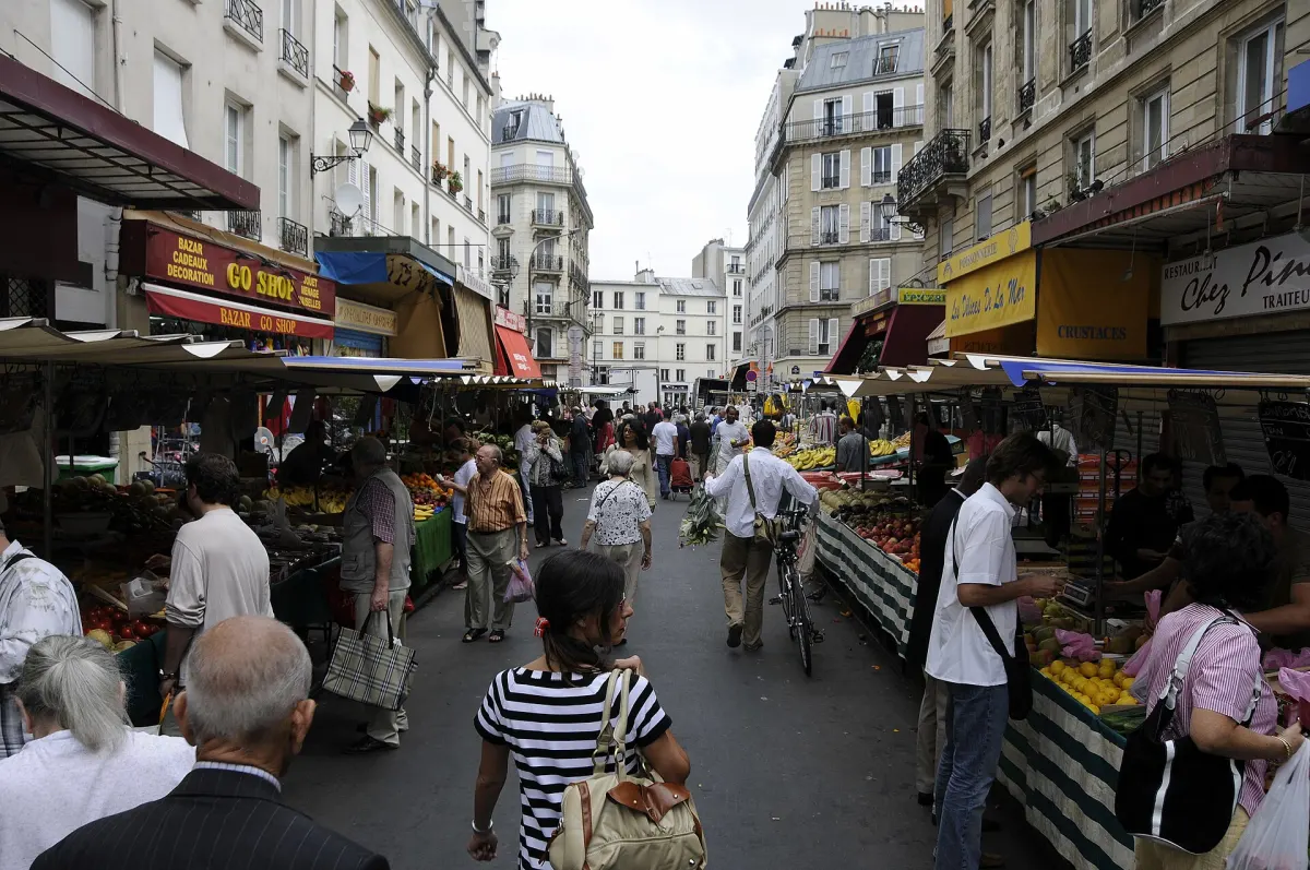 Shoppers and produce stalls on the open-air Marche d'Aligre in the 12th arrondissement of Paris