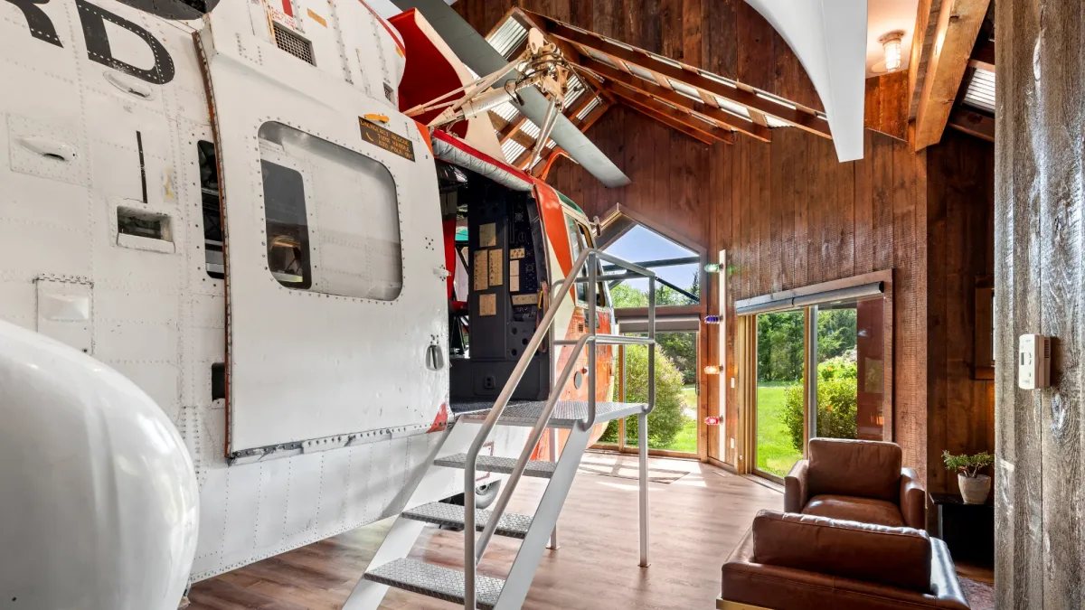 The Helicopter cottage at Winvian Farm in Morris, Connecticut, with a restored helicopter inside the living room