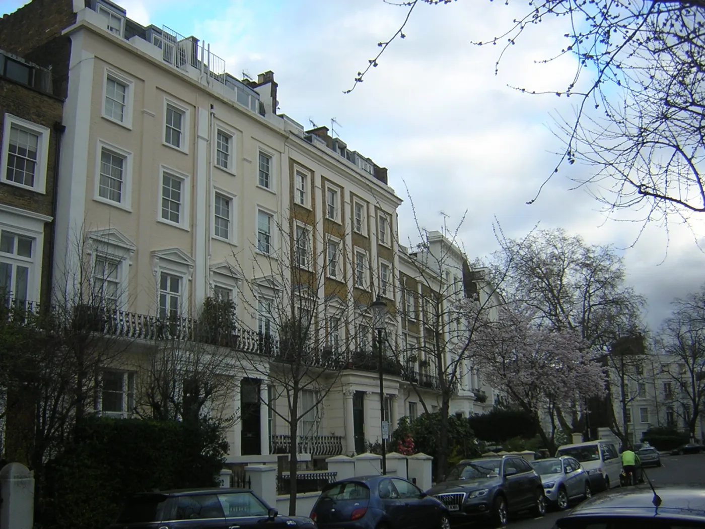 white stucco London townhouses on a quiet Notting Hill street near Six Senses London