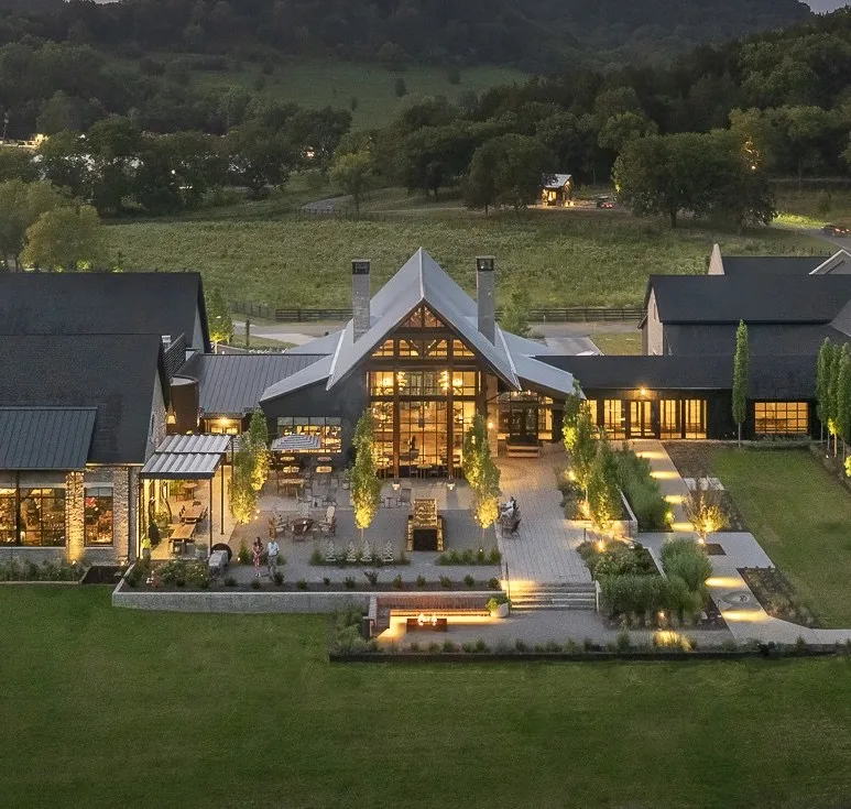 luxury farm stay inn at dusk over tennessee farmland aerial