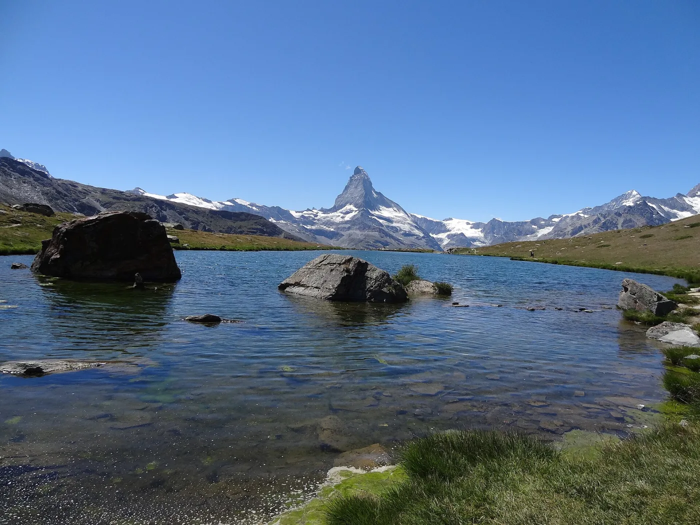 The Matterhorn reflected in an alpine lake near Zermatt on a clear summer day