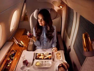 Emirates A380 first class private suite with dining service — business class vs first class comparison