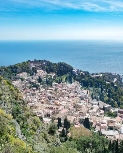 aerial view of Taormina and its ancient Greek theatre on the Sicily coast