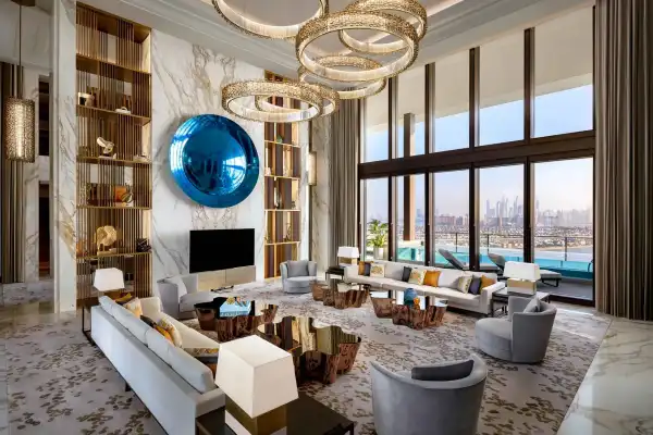 Royal Mansion Penthouse living room at Atlantis The Royal Dubai with gold chandeliers marble walls and Arabian Gulf views