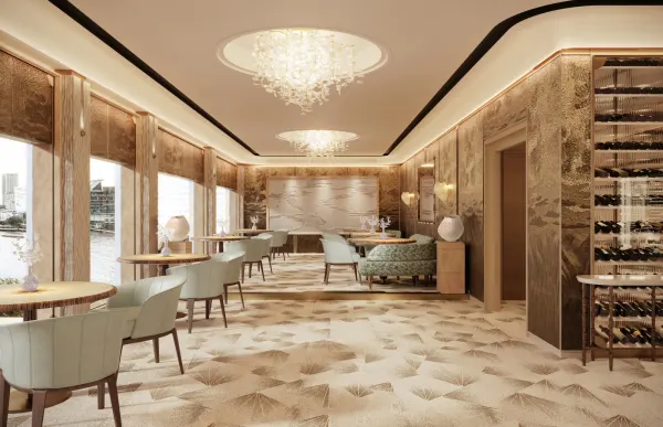 The golden riverside dining room of Le Normandie at Mandarin Oriental Bangkok, among the best hotel restaurants in the world