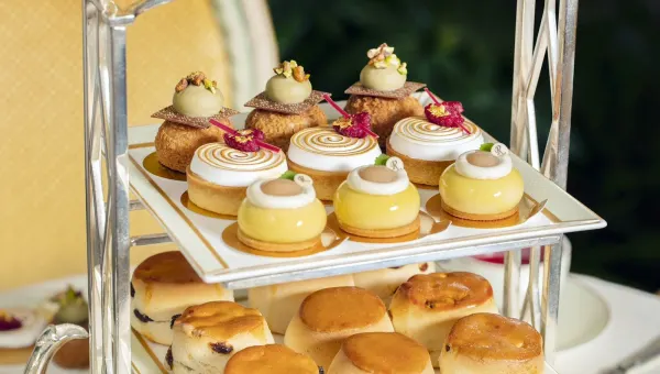 Afternoon tea pastries on a tiered stand at The Ritz London Palm Court