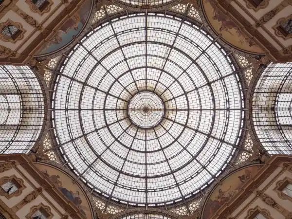 The glass-and-iron dome of the Galleria Vittorio Emanuele II in Milan, seen from below