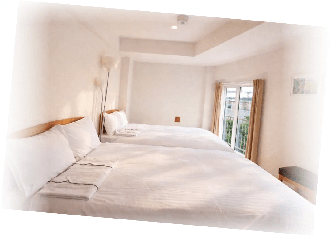 사쿠라_호텔_하타가야_쿼드룸_-_침대