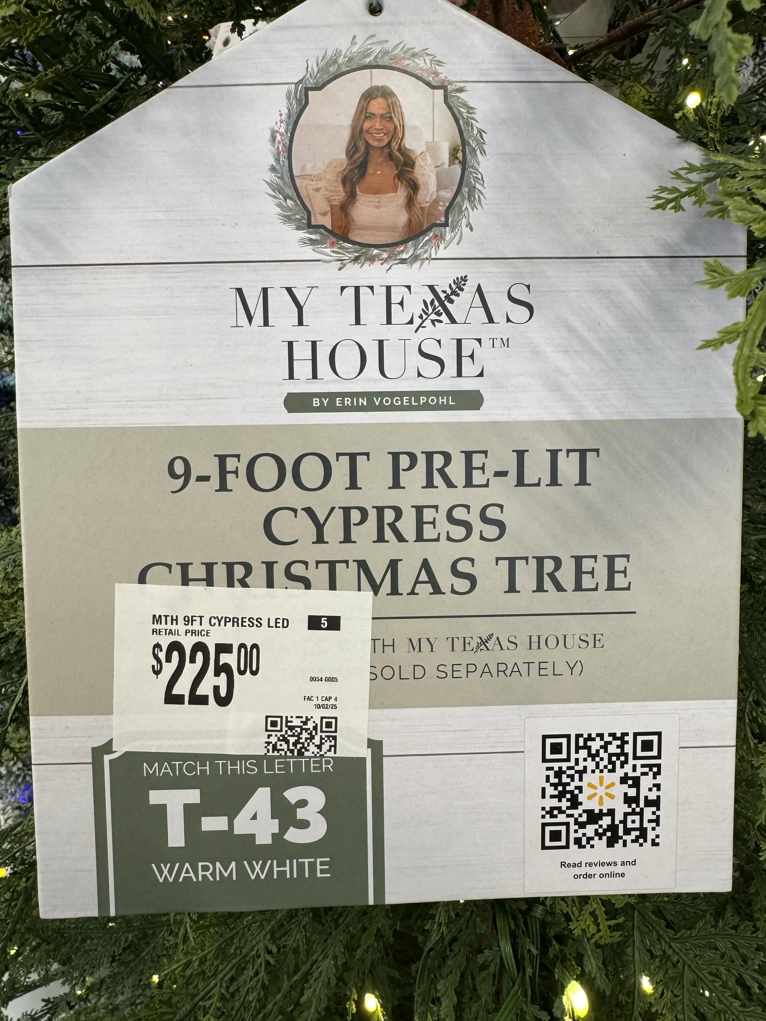 Product sign: 9ft pre-lit cypress tree, $225, model T-43, warm white lights, ornaments sold separately